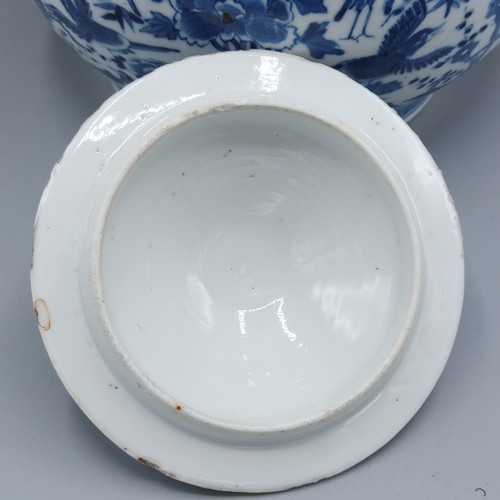 14 - A Chinese blue and white covered jar, decorated with birds amongst foliage, four character marks to ... 