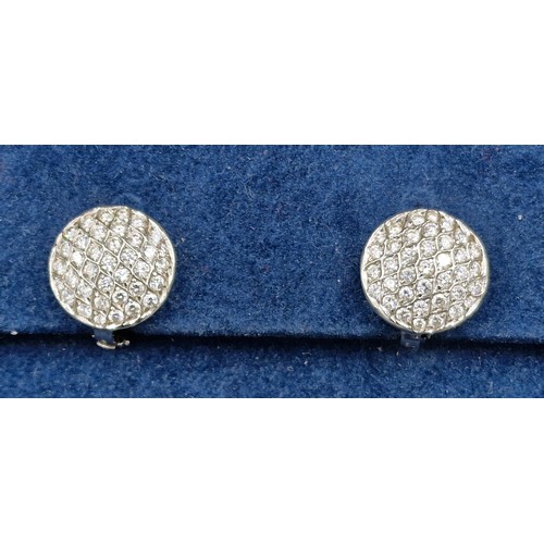 A pair of 18ct white gold Diamond cluster earstuds within a Theo ...