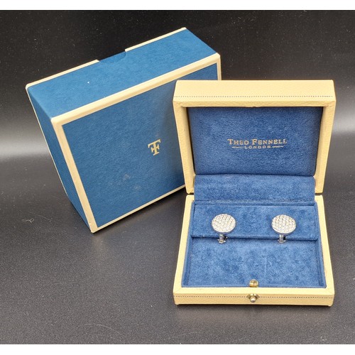 A pair of 18ct white gold Diamond cluster earstuds within a Theo ...