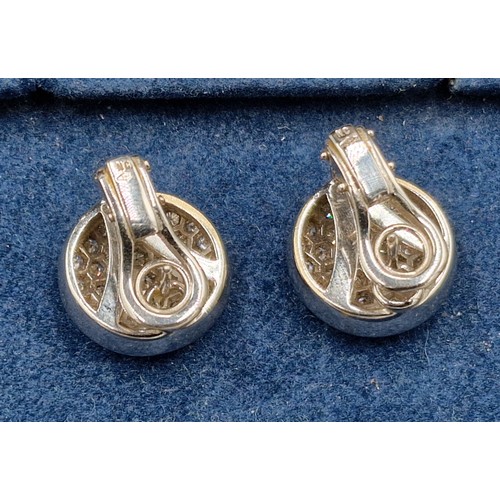 A pair of 18ct white gold Diamond cluster earstuds within a Theo ...