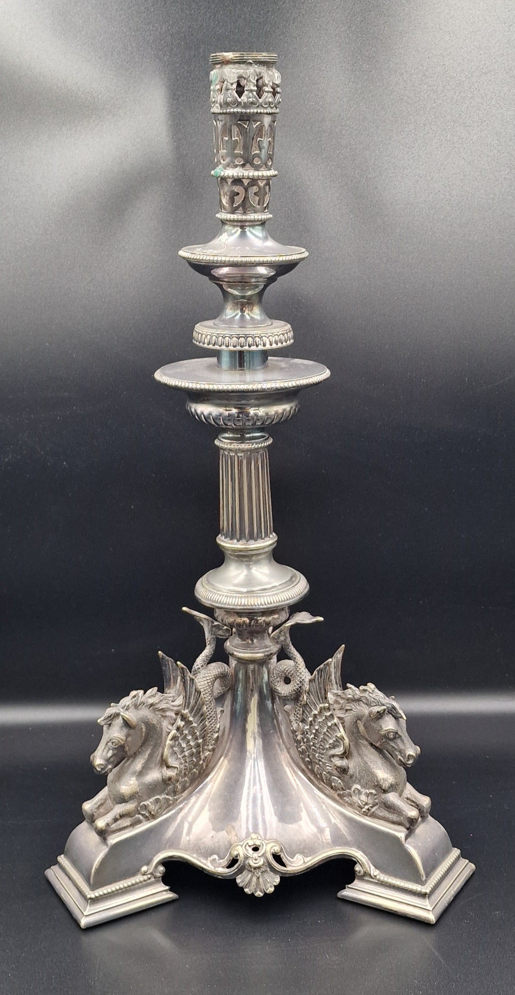 A 19th Century silver plated table centre candlestick decorated tri ...