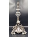 A 19th Century silver plated table centre candlestick decorated tri ...