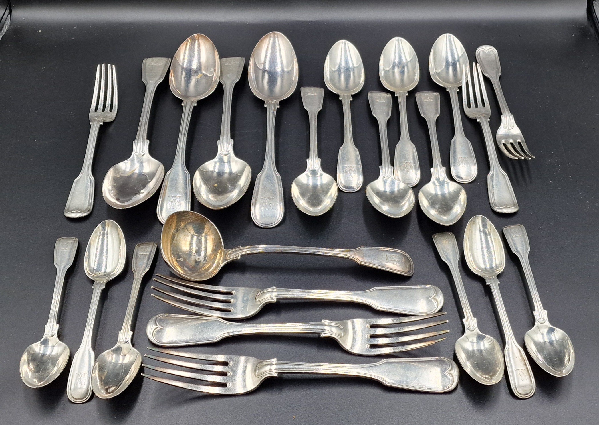 A Victorian silver canteen of flatware comprising four table spoons ...