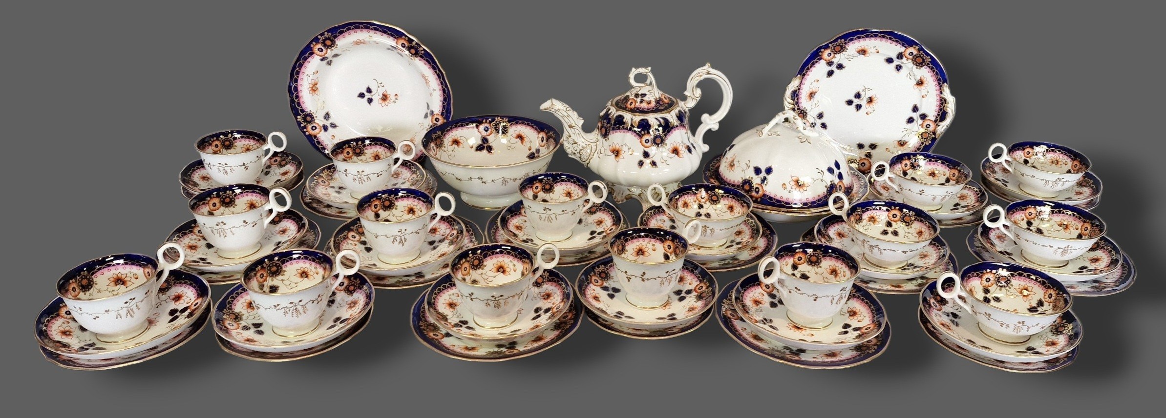 A 19th Century English porcelain tea service comprising tea cups and ...