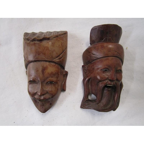 121 - 2 carved Oriental heads - H: 10cm