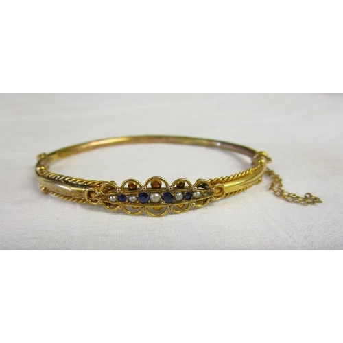 62 - Antique gold sapphire & seed pearl bangle in original box