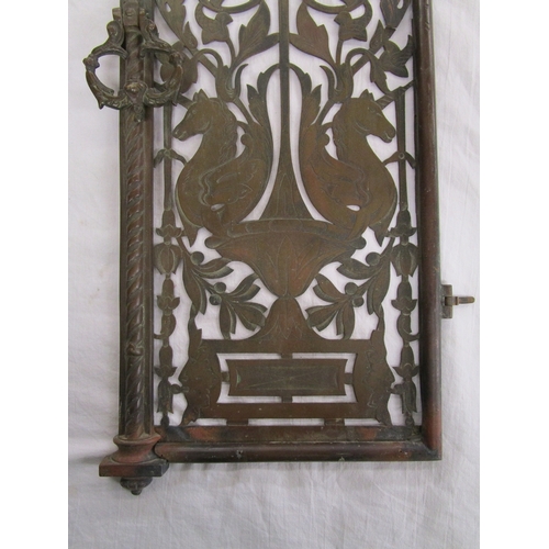 223 - Pair of early brass pierced grill doors