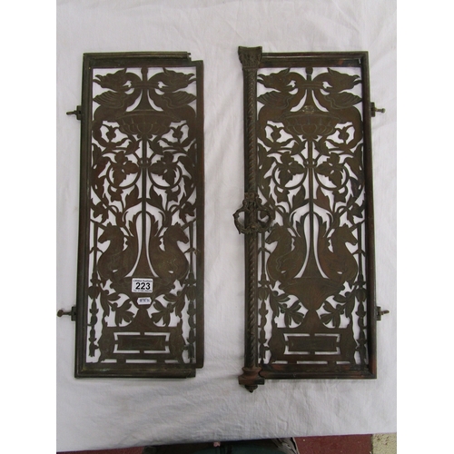 223 - Pair of early brass pierced grill doors