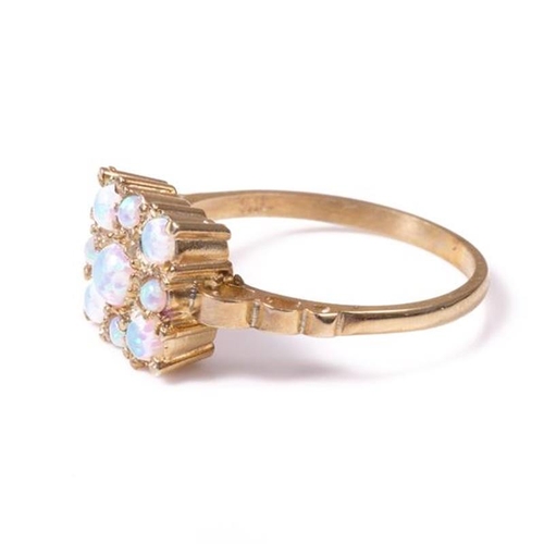 13 - 18ct silver-gilt opal (0.60ct) ring