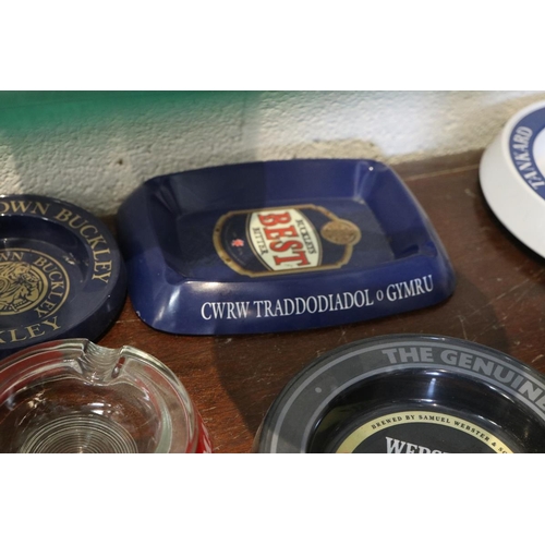 128 - Collection of pub advertising ashtrays