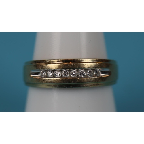 31 - Gold channel set diamond ring