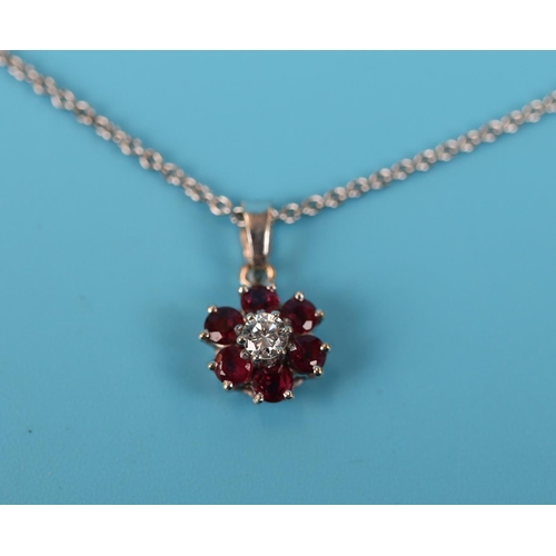 54 - 18ct white gold ruby & diamond pendant on chain