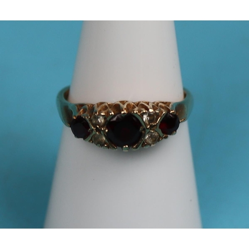 31 - Gold garnet gypsy set ring