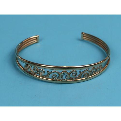 43 - Gold blue topaz set bangle