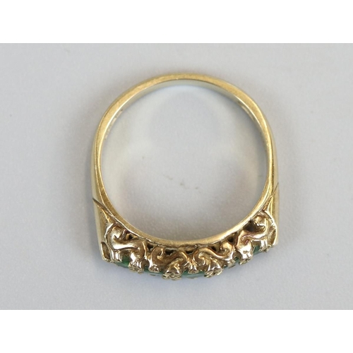 28 - Gold emerald set ring, size O½