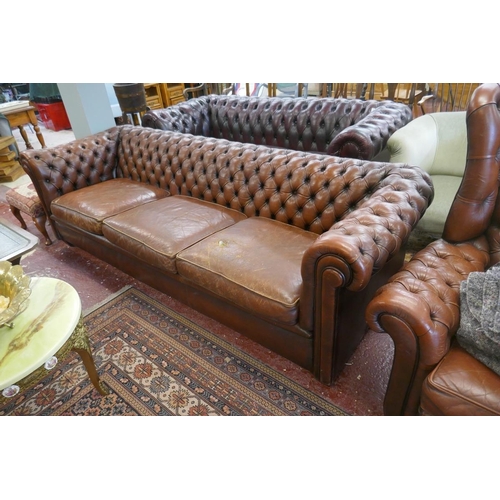 370 - 3 seater brown leather Chesterfield sofa - Tear in one cushion - Approx L: 235cm