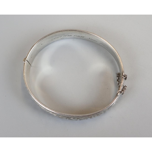 68 - Hallmarked silver bangle along with another marked '9ct metal core'