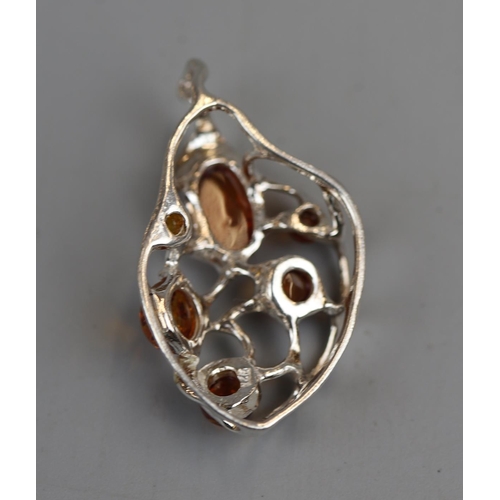 31 - Unusual silver & amber pendant