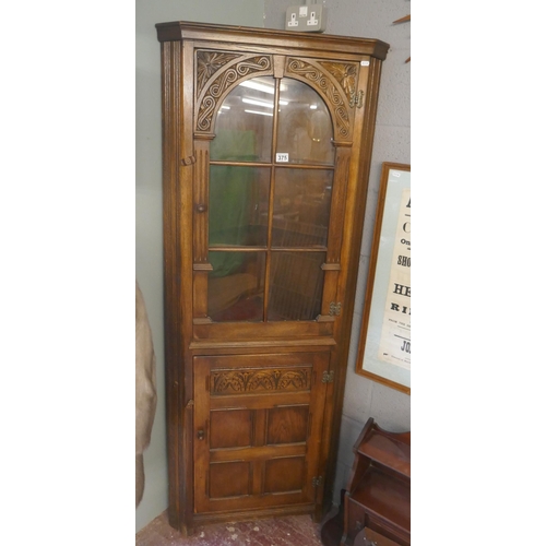 375 - Oak glazed corner cupboard