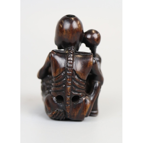 78 - 3 wooden Netsukes & Netsuke collectors book