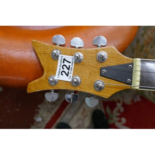 227 - Collection of six electric guitars together with amp & metronome