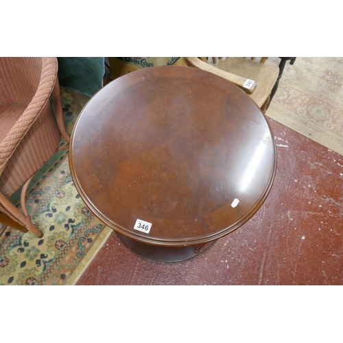 346 - Unusual mahogany revolving table with shelving to base