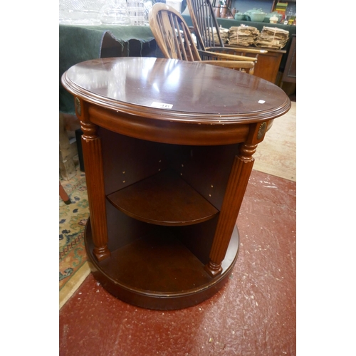 346 - Unusual mahogany revolving table with shelving to base