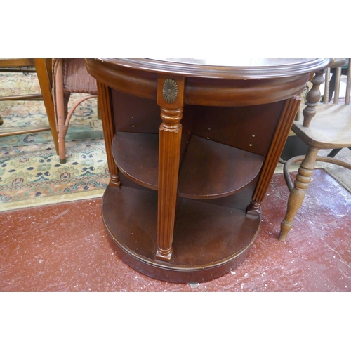 346 - Unusual mahogany revolving table with shelving to base