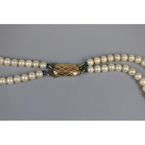 38 - Simulated pearl necklace by Hanako with gold clasp