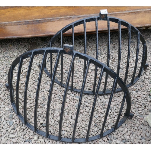 424 - Pair of cast iron hay feeders