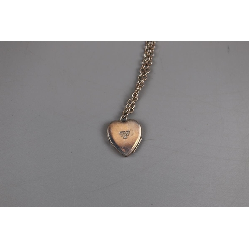 49 - Silver locket on chain & silver ring