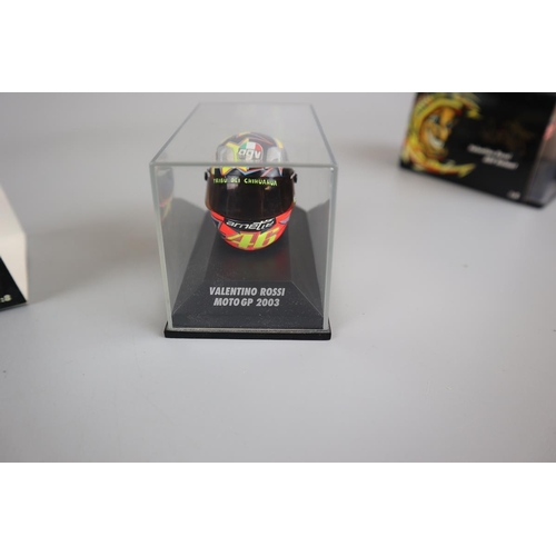 147 - Collection of 14 Minichamps 1:8 scale model AVG Valentino Rossi helmets