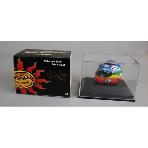 147 - Collection of 14 Minichamps 1:8 scale model AVG Valentino Rossi helmets