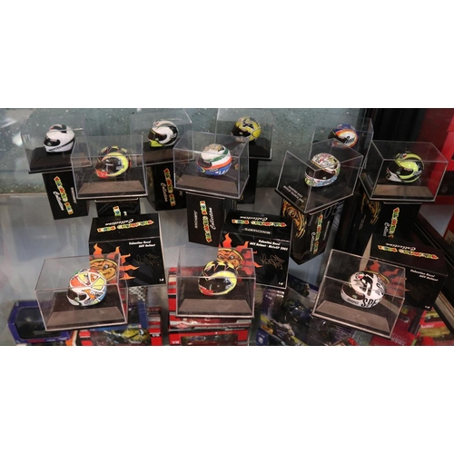 150 - Collection of 11 Minichamps 1:8 scale model AVG Valentino Rossi helmets