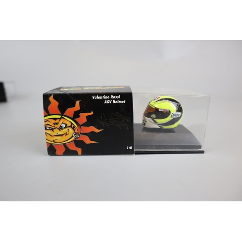 150 - Collection of 11 Minichamps 1:8 scale model AVG Valentino Rossi helmets