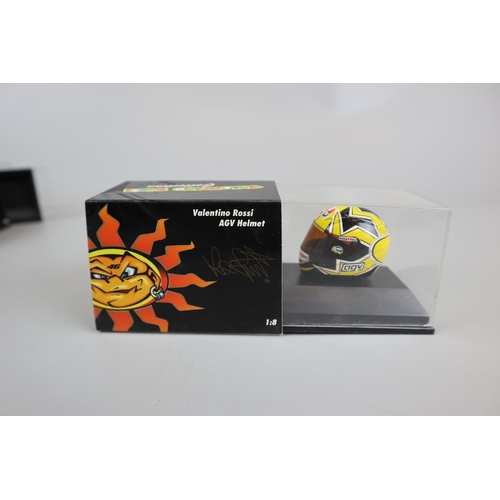 150 - Collection of 11 Minichamps 1:8 scale model AVG Valentino Rossi helmets