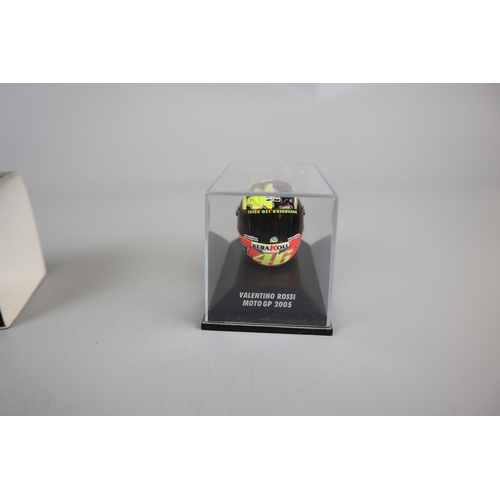 150 - Collection of 11 Minichamps 1:8 scale model AVG Valentino Rossi helmets