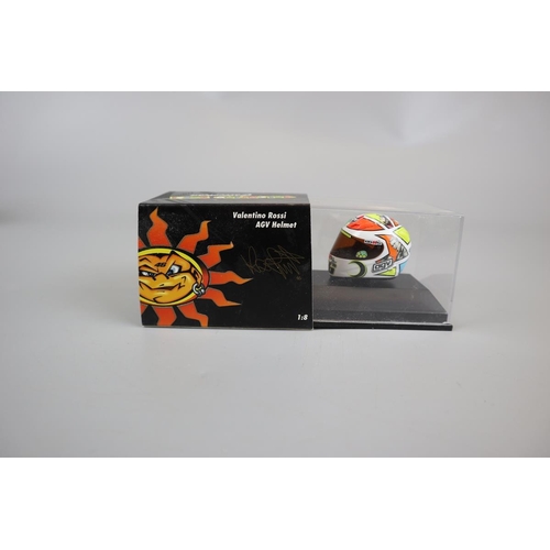 150 - Collection of 11 Minichamps 1:8 scale model AVG Valentino Rossi helmets