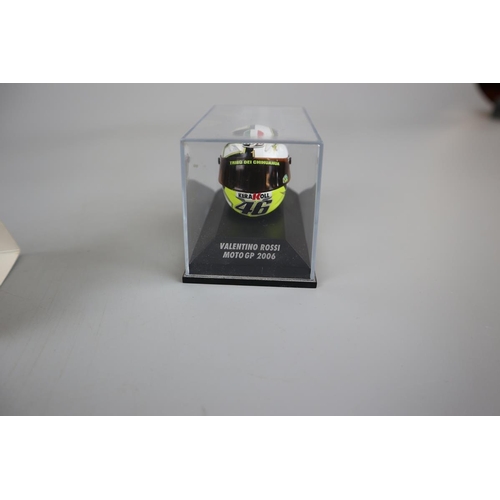 150 - Collection of 11 Minichamps 1:8 scale model AVG Valentino Rossi helmets