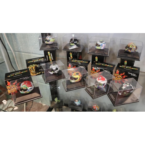 152 - Collection of 9 Minichamps 1:8 scale model AVG Valentino Rossi helmets