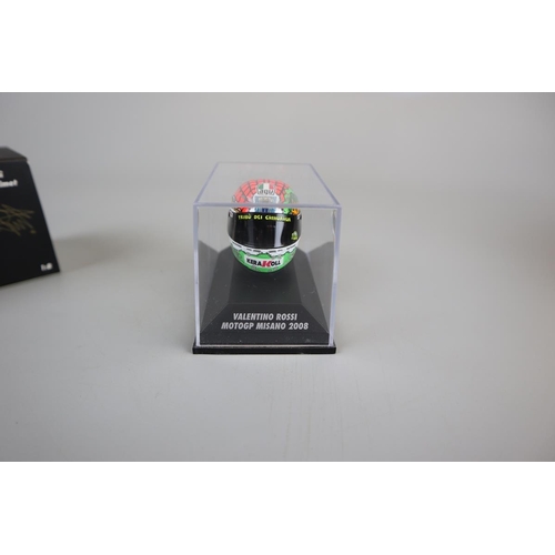 152 - Collection of 9 Minichamps 1:8 scale model AVG Valentino Rossi helmets