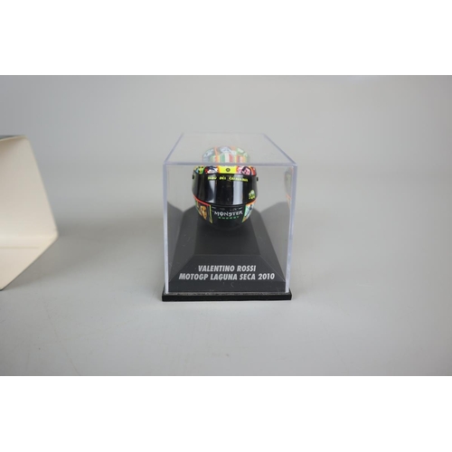 154 - Collection of 8 Minichamps 1:8 scale model AVG Valentino Rossi helmets