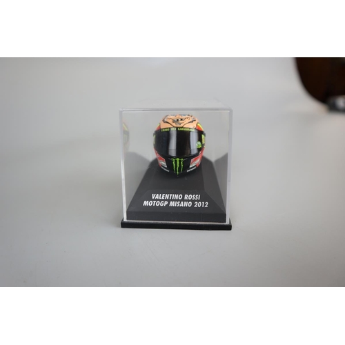 155 - Collection of 13 Minichamps 1:8 scale model AVG Valentino Rossi helmets