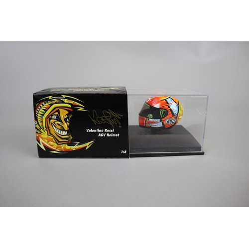 155 - Collection of 13 Minichamps 1:8 scale model AVG Valentino Rossi helmets