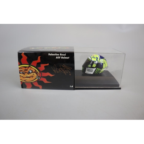 155 - Collection of 13 Minichamps 1:8 scale model AVG Valentino Rossi helmets