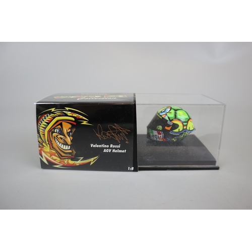 155 - Collection of 13 Minichamps 1:8 scale model AVG Valentino Rossi helmets