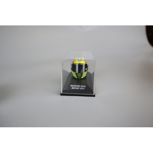 155 - Collection of 13 Minichamps 1:8 scale model AVG Valentino Rossi helmets