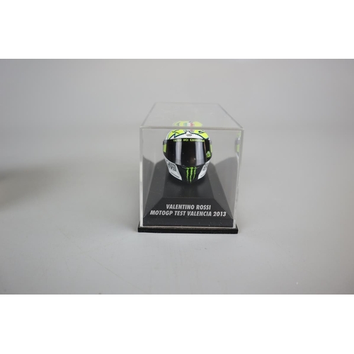 155 - Collection of 13 Minichamps 1:8 scale model AVG Valentino Rossi helmets