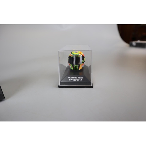 155 - Collection of 13 Minichamps 1:8 scale model AVG Valentino Rossi helmets