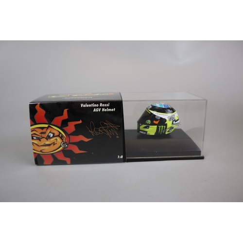 155 - Collection of 13 Minichamps 1:8 scale model AVG Valentino Rossi helmets